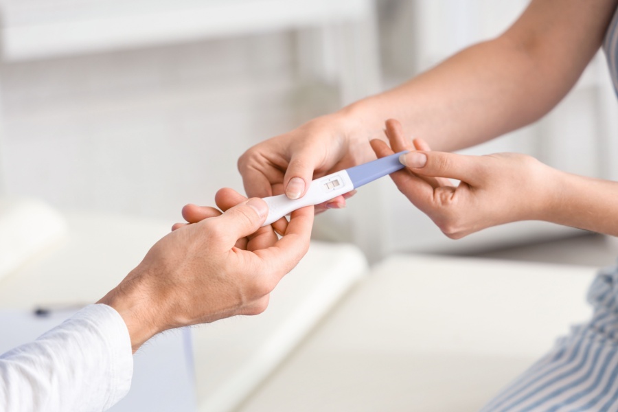 Doctor showing pregnancy test