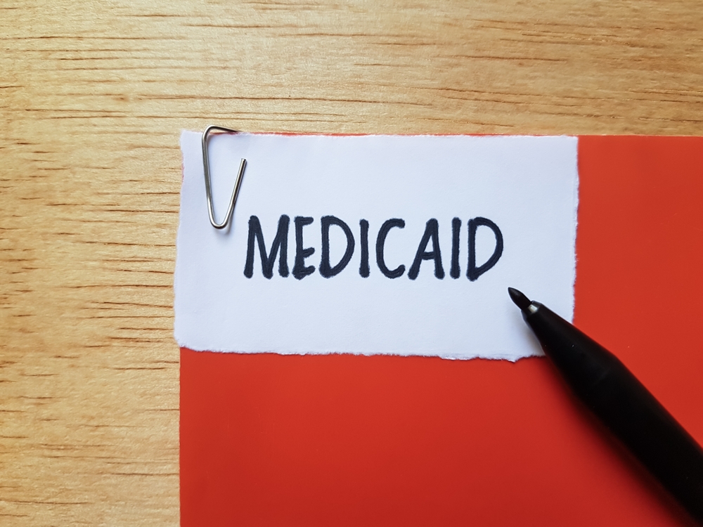 Medicaid writing on a folder